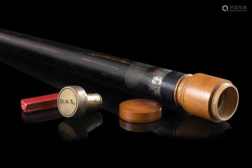 An ebonised wood walking stick with a bronze and nacre seal ...