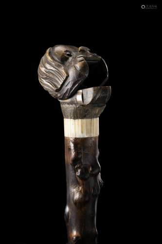 A smoker walking stick with a dog head-shaped handle hiding ...