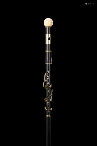 An early 20th-century clarinet ebony walking stick with ivor...