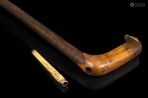 Lady’s wooden walking stick hiding an ivory and gold mouthpi...