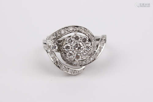 A platinum and brilliant cut diamonds cluster ring circa 197...