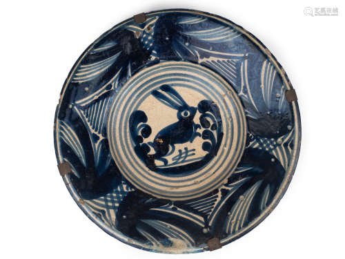 A late 17th century plate in Catalan pottery of 'la corbata'