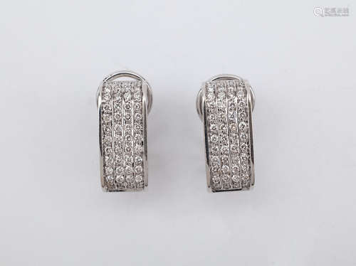 A pair of white gold and diamonds earrings circa 1990-1999