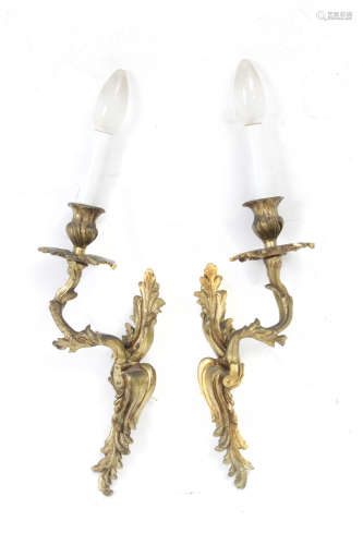 A pair of Louis XVI style bronze wall lights