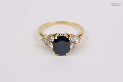 An 18k. yellow gold, sapphire and diamonds ring