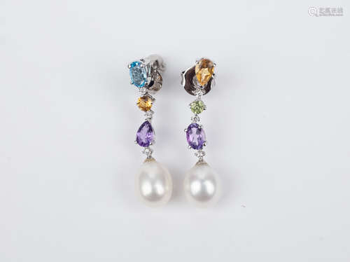 A pair of long earrings. 18k., white gold, topaz from Brazil...