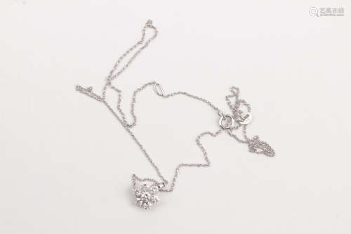 A brilliant cut diamonds and 18k. white gold cluster pendant