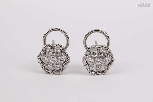 A pair of brilliant cut diamonds and 18k. white gold cluster...