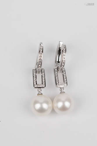 A pair of 18k. white gold, diamonds and cultured pearls long...