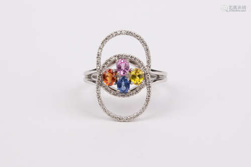 An 18k. yellow gold, sapphires and diamonds ring