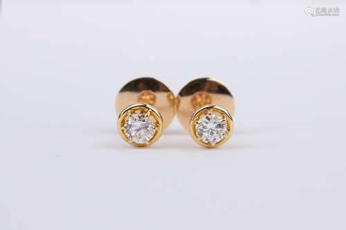 A pair of 18k. yellow gold and diamond stud earrings