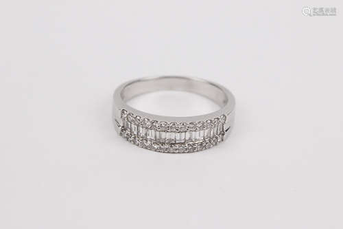 An 18k. white gold and diamonds half eternity ring