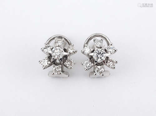 A pair of 18k. white gold and diamonds cluster earrings circ...