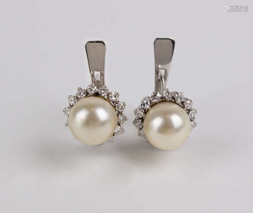 Carreras. A pair of diamond and cultured pearls cluster earr...