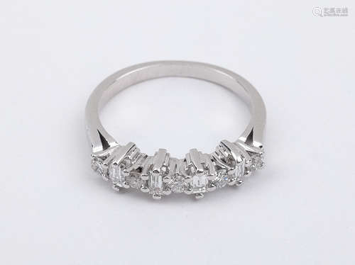 A baguette and brilliant cut diamonds half eternity ring