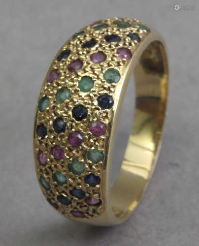 An 18k. Yellow gold, diamonds, emerald and rubies bombe ring