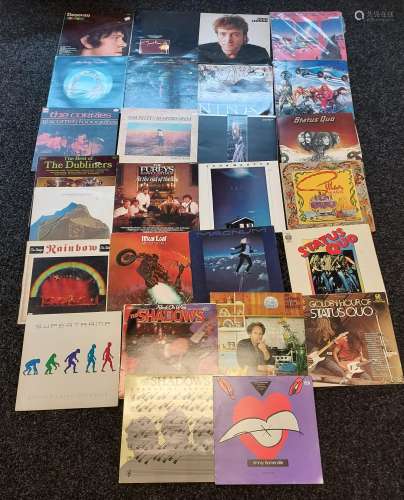 A Collection of records to include Magnum, Status Quo, Rainb...