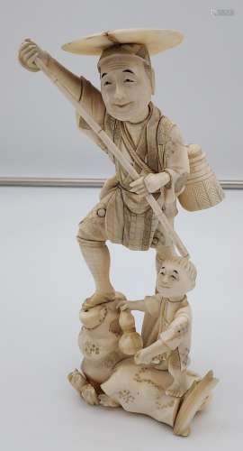 A large 19th century Japanese Ivory figure of an elderly gen...