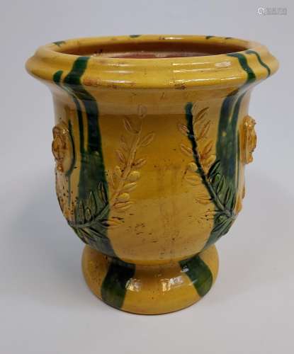 A Large antique Majolica plant pot. Designed in a yellow and...