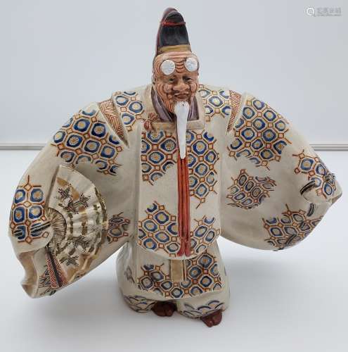A 19th century Satsuma figure of a Scholar wearing a mask, k...