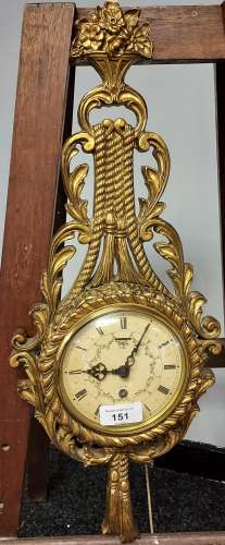 A Vintage Smiths wall clock fitted within a gilt regency sty...