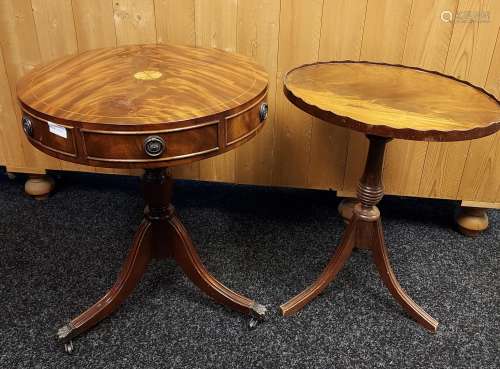 A Reproduction barrel top wine table with various under draw...