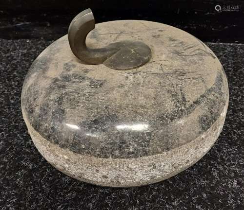 Antique curling stone with part handle.