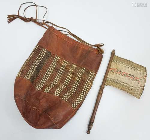 Tribal leather, weaved carry bag and swat/ brush?