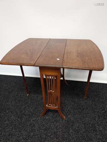 An antique mahogany Sutherland drop leaf table, supported on...