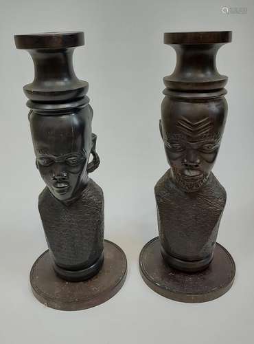 A Pair of hand carved African busts. [34cm in height]