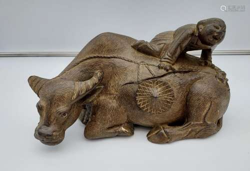 Antique hand carved Chinese figure climbing a buffalo. [33cm...