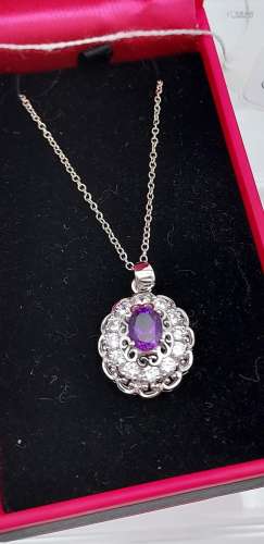 A silver & CZ pendant necklace with central amethyst panel