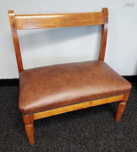 A 19th century window two seat loving chair. Reupholstered i...