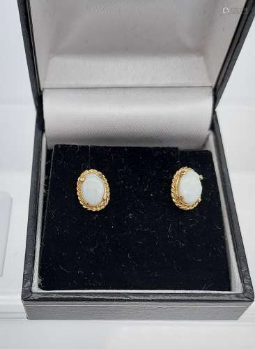 A Pair of 9ct gold and opal earrings.