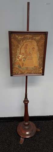 A 19th century pole screen with embroidered tapestry. [164cm...