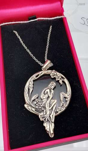A silver & onyx pendant necklace with a mermaid design