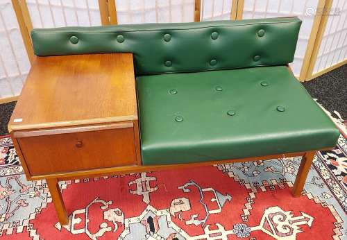A Mid century teak and faux green leather telephone table. [...