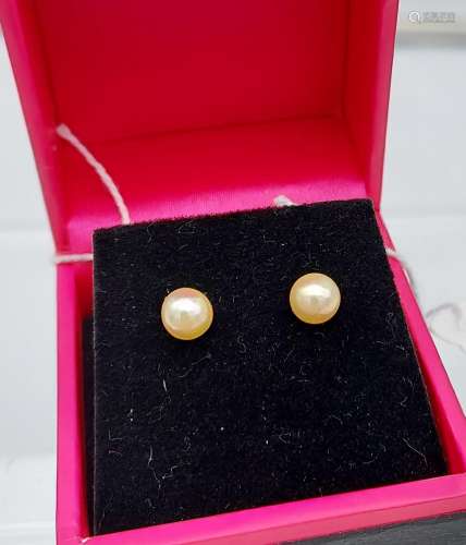 A pair of fresh water pearl stud earrings with silver posts