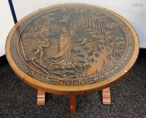 An oriental hand carved panel side table.