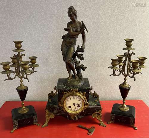 A Three piece 19th century French mantle clock and candelabr...