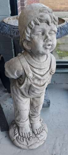 A Large and heavy concrete garden boy figure. [77cm in heigh...