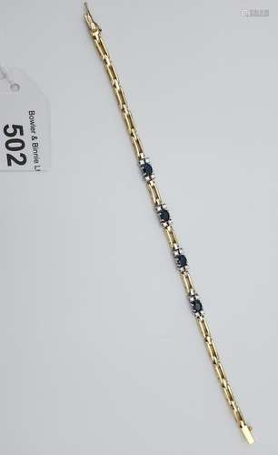 An impressive 14ct yellow gold sapphire and diamond bracelet...