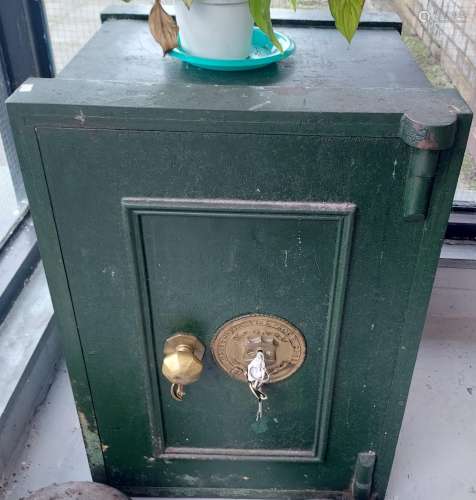 An Antique heavy safe with key. [70x49x50cm]