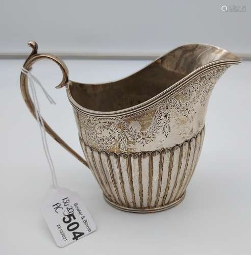 A Victorian ornate Sheffield silver cream jug produced by Ma...