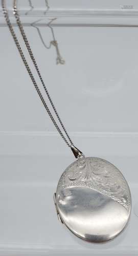 A large silver locket and chain.