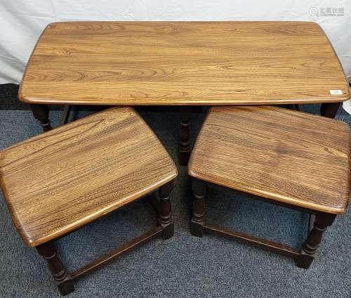 A Vintage Elm wood Ercol coffee table with two matching pull...