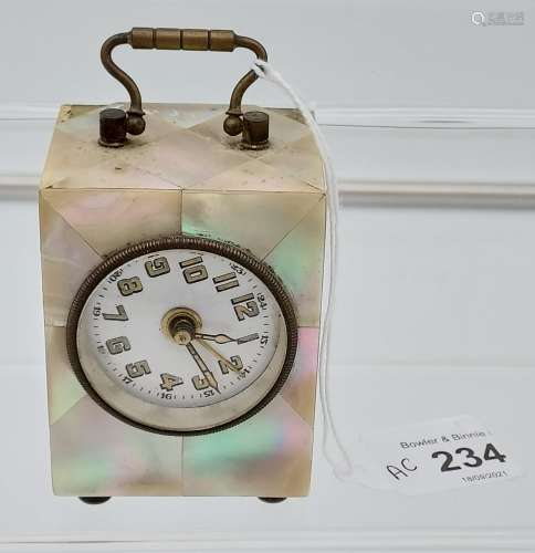 An Antique Mother of pearl cased travel clock.