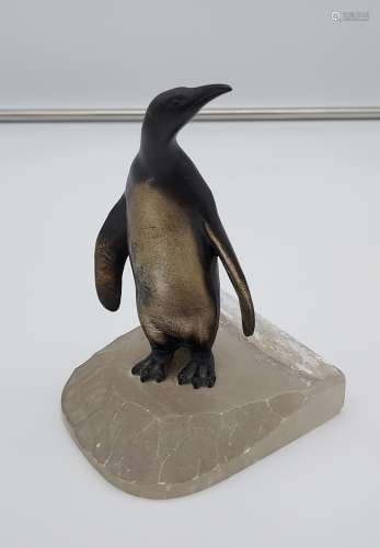 A Cold painted penguin figurine sat upon an iceberg. [12cm i...