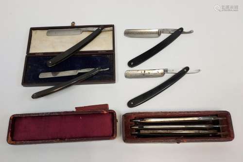 A Selection of antique cut throat razors.