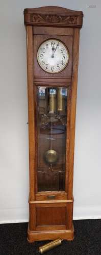 An oak cased Grandfather clock, with hand carved foliage des...